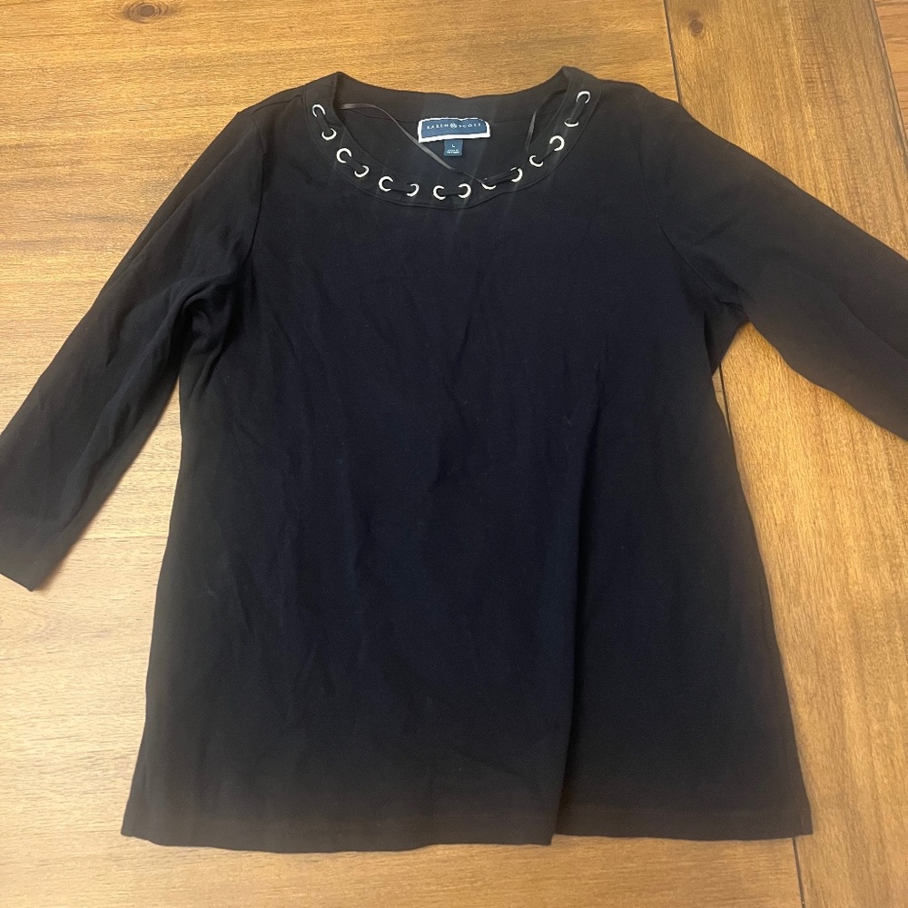 Top with metal embellishments around the collar.